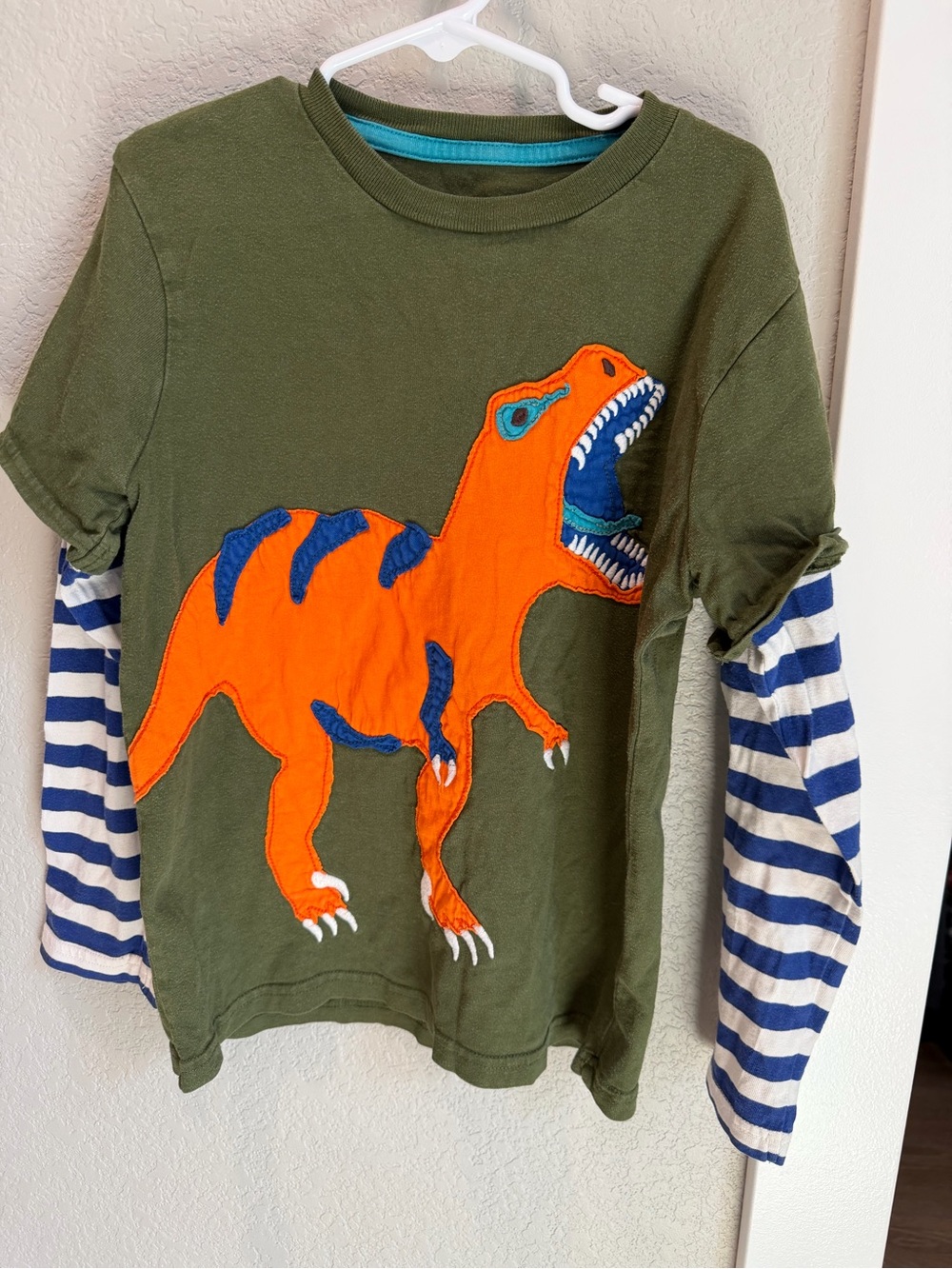 Mini Boden Olive Green Long-Sleeve Tee with Bright Orange Dino and Navy Stripes